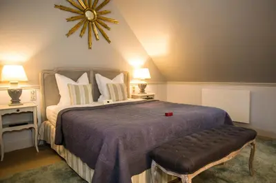 Un ou plusieurs lits dans un hébergement de l'établissement Gîte du Manoir