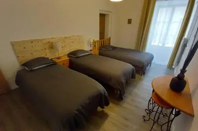 Un ou plusieurs lits dans un hébergement de l'établissement Gîte Maison Anjou 14 personnes Logis de la Porte Saint Jean