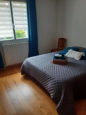 Un ou plusieurs lits dans un hébergement de l'établissement Chambre à 5 minutes du circuit