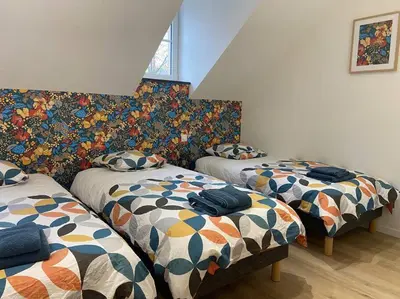 Un ou plusieurs lits dans un hébergement de l'établissement Les prunelles maison de village de 4 à 8 personnes