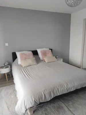 Un ou plusieurs lits dans un hébergement de l'établissement Chambre Ruaudin