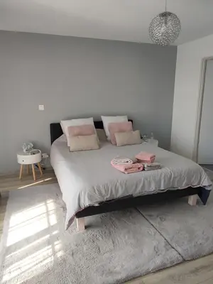 Un ou plusieurs lits dans un hébergement de l'établissement Chambre Ruaudin