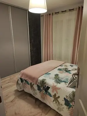 Un ou plusieurs lits dans un hébergement de l'établissement Chambre à louer proche circuit