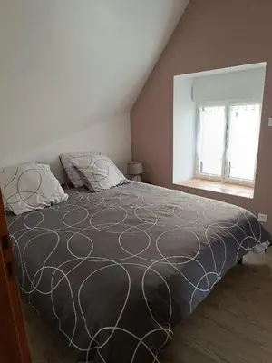 Un ou plusieurs lits dans un hébergement de l'établissement Gîte de la Grand Maison le Noyer