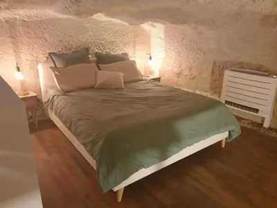 Un ou plusieurs lits dans un hébergement de l'établissement La Grotte du Bonheur