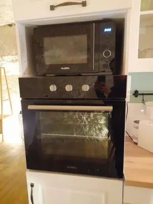Cuisine ou kitchenette dans l'établissement La Grotte du Bonheur