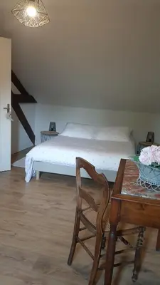 Un ou plusieurs lits dans un hébergement de l'établissement Gîte Les Rimbaudières à Ligueil