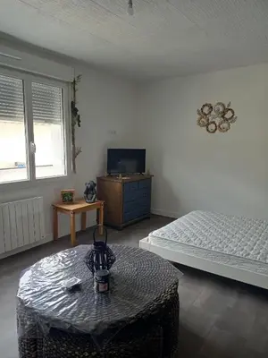 Un ou plusieurs lits dans un hébergement de l'établissement Appart 3 chambres