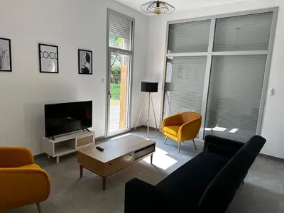 Télévision ou salle de divertissement dans l'établissement Maison gîte Solesmes