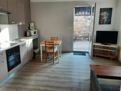 Cuisine ou kitchenette dans l'établissement Maisonnette en hyper centre