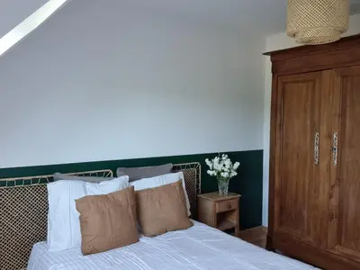 Un ou plusieurs lits dans un hébergement de l'établissement Chambres d'hôtes Le Petit Gravier