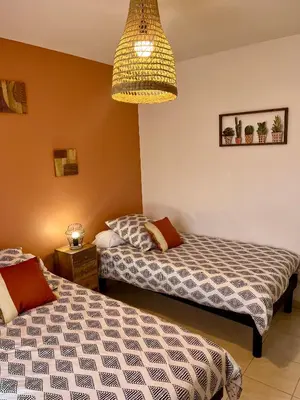 Un ou plusieurs lits dans un hébergement de l'établissement Gîte Basilic