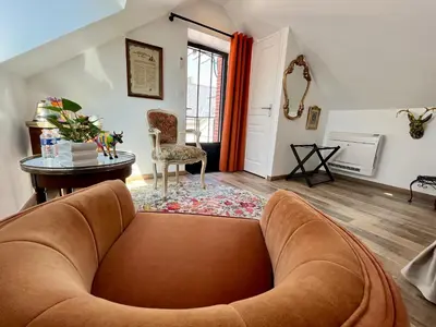 Coin salon dans l'établissement Cave Auger La Maison d'Hôtes