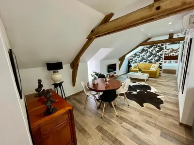Coin salon dans l'établissement Cave Auger La Maison d'Hôtes