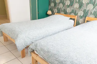 Un ou plusieurs lits dans un hébergement de l'établissement T4 - Charmant Appartement à Saint Aignan