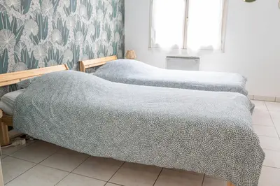 Un ou plusieurs lits dans un hébergement de l'établissement T4 - Charmant Appartement à Saint Aignan