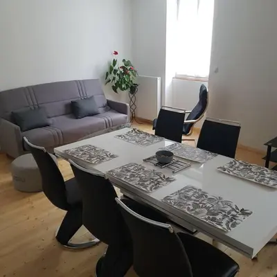 Coin salon dans l'établissement Appartement Malawo