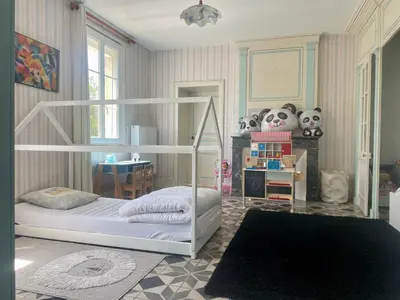 Un ou plusieurs lits dans un hébergement de l'établissement La maison bleue
