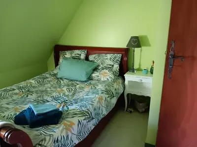 Un ou plusieurs lits dans un hébergement de l'établissement Chambre d'hôtes La Montjoie