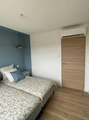 Un ou plusieurs lits dans un hébergement de l'établissement Gîte Luna ; villa 6 personnes avec jaccuzi