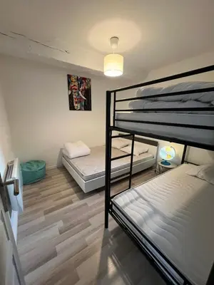 Un ou plusieurs lits dans un hébergement de l'établissement Gîte Les 4 Terres - Maison 2 chambres