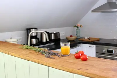 Cuisine ou kitchenette dans l'établissement Gîte de la Forge, le Grenier