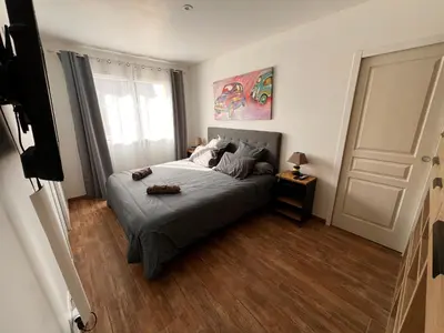 Un ou plusieurs lits dans un hébergement de l'établissement Maison chaleureuse tout confort