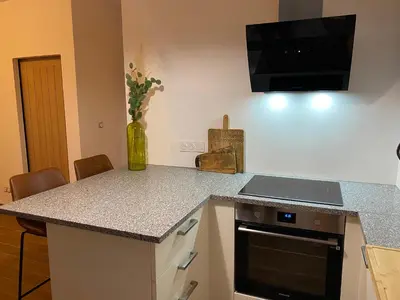 Cuisine ou kitchenette dans l'établissement Le Jasmin
