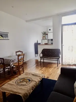 Coin salon dans l'établissement Appartement tempéré avec terrasse