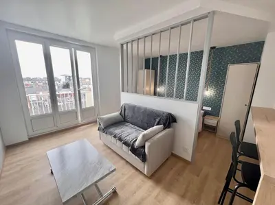Coin salon dans l'établissement Appartement proche des prébendes