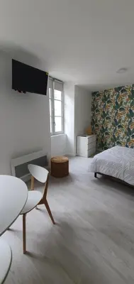 Un ou plusieurs lits dans un hébergement de l'établissement Agréable studio