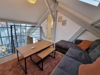 Coin salon dans l'établissement Superbe duplex La Verrière chic, cosy et spacieux