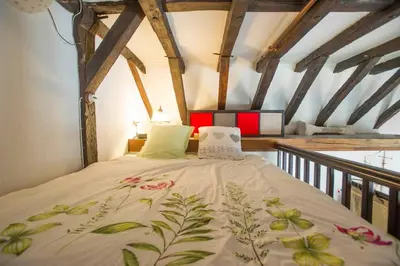 Un ou plusieurs lits dans un hébergement de l'établissement Appartement de caractère au cœur du vieux Tours