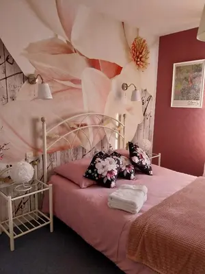 Un ou plusieurs lits dans un hébergement de l'établissement Le Relais du Chateau