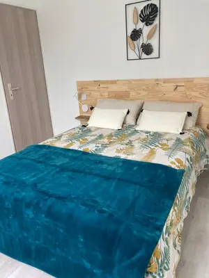 Un ou plusieurs lits dans un hébergement de l'établissement Gîte du Pré Rond