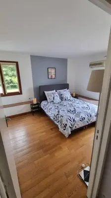 Un ou plusieurs lits dans un hébergement de l'établissement Maison à l'Orée des bois