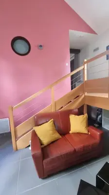 Coin salon dans l'établissement Maison à l'Orée des bois
