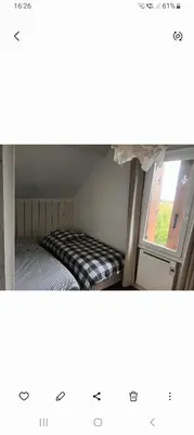 Un ou plusieurs lits dans un hébergement de l'établissement La chouett'chambre