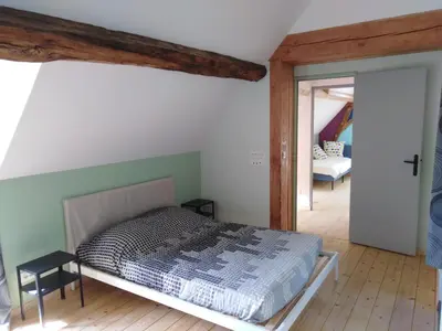 Un ou plusieurs lits dans un hébergement de l'établissement Gîte mon p'ti bout