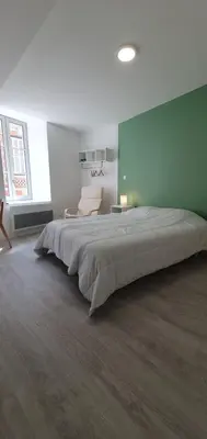 Un ou plusieurs lits dans un hébergement de l'établissement Charmant studio centre de Bourgueil