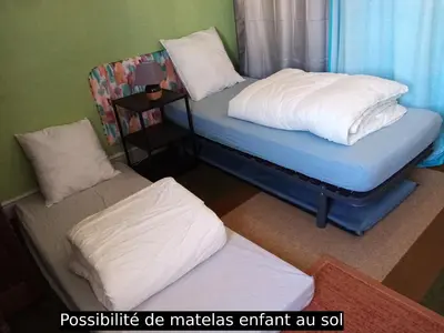 Un ou plusieurs lits dans un hébergement de l'établissement L'Appart' Abri vélos - Bikes shelter