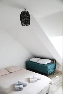 Un ou plusieurs lits dans un hébergement de l'établissement Maison - 3 chambres - Jardin