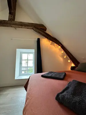Un ou plusieurs lits dans un hébergement de l'établissement Appartement atypique et chaleureux - 1 chambre