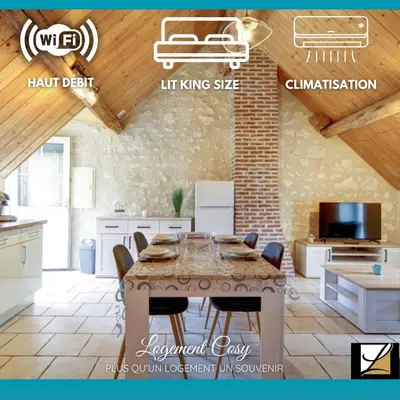 Télévision ou salle de divertissement dans l'établissement Les logements dans longère de la Gentinière