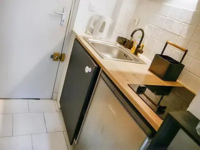 Cuisine ou kitchenette dans l'établissement Studio cosy hypercentre Terrasse