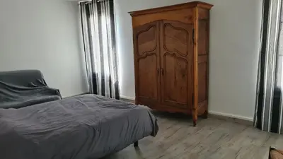 Un ou plusieurs lits dans un hébergement de l'établissement Maison Bourgueil 3 chambres