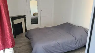 Un ou plusieurs lits dans un hébergement de l'établissement Maison Bourgueil 3 chambres