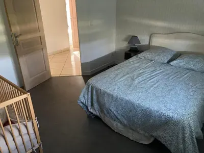 Un ou plusieurs lits dans un hébergement de l'établissement Maison de vacances
