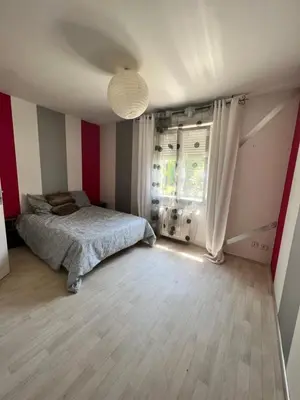 Un ou plusieurs lits dans un hébergement de l'établissement Maison de vacances