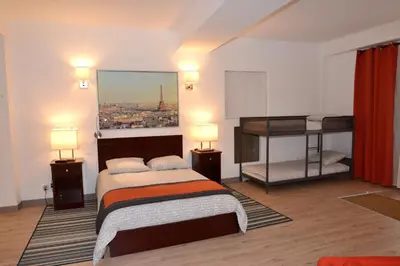 Un ou plusieurs lits dans un hébergement de l'établissement Les Chambres Panda